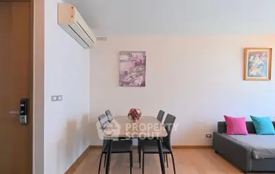 Modern dining area with air conditioning and cozy seating, perfect for family gatherings.