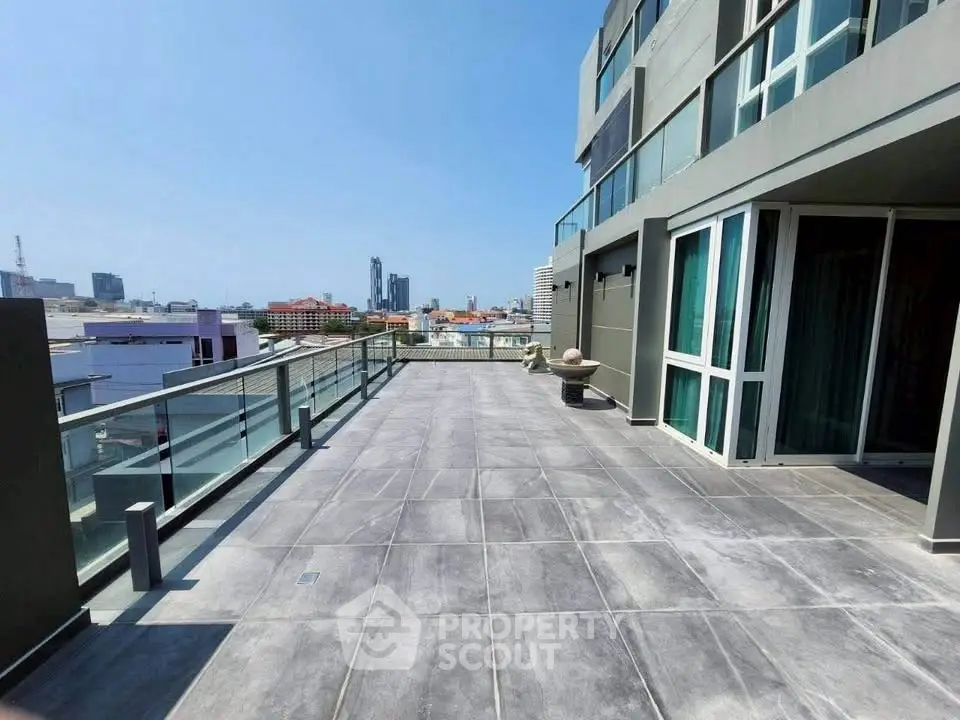Spacious rooftop terrace with city views and modern design.