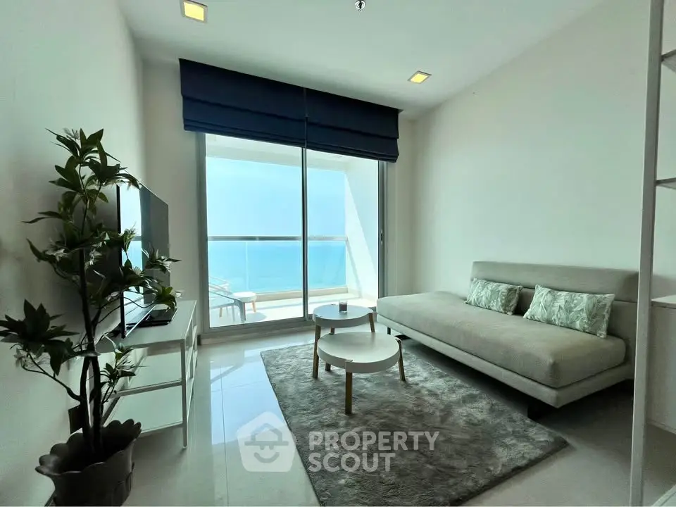 Modern living room with ocean view and sleek furnishings