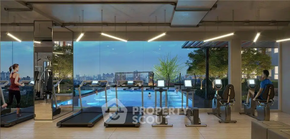 Luxurious gym with pool view and modern equipment in upscale residential complex.