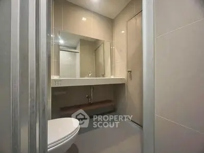 Modern bathroom with sleek design and large mirror