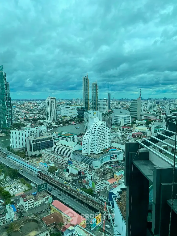 Stunning cityscape view from high-rise building showcasing urban skyline and architectural diversity.