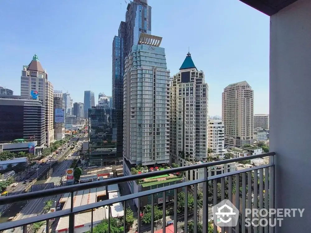 Stunning cityscape view from a high-rise balcony in a bustling urban area.