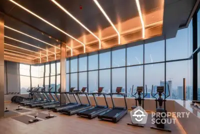 Luxurious high-rise gym with panoramic city views and modern fitness equipment.