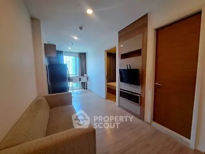 Modern apartment living room with sleek design and natural light