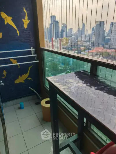 Chic urban balcony with stunning city skyline view and artistic wall decor.