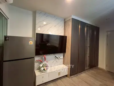 Modern living room with sleek TV setup and stylish storage solutions