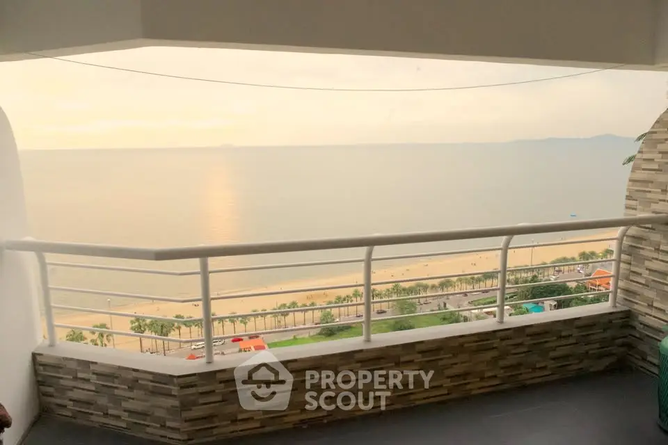 Stunning beachfront balcony with panoramic ocean views and modern railing.