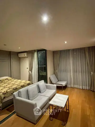 Spacious modern living room with cozy seating and elegant decor