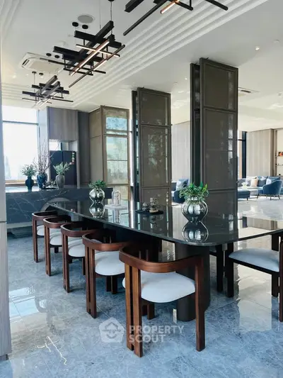 Luxurious modern dining area with elegant decor and large windows offering natural light.
