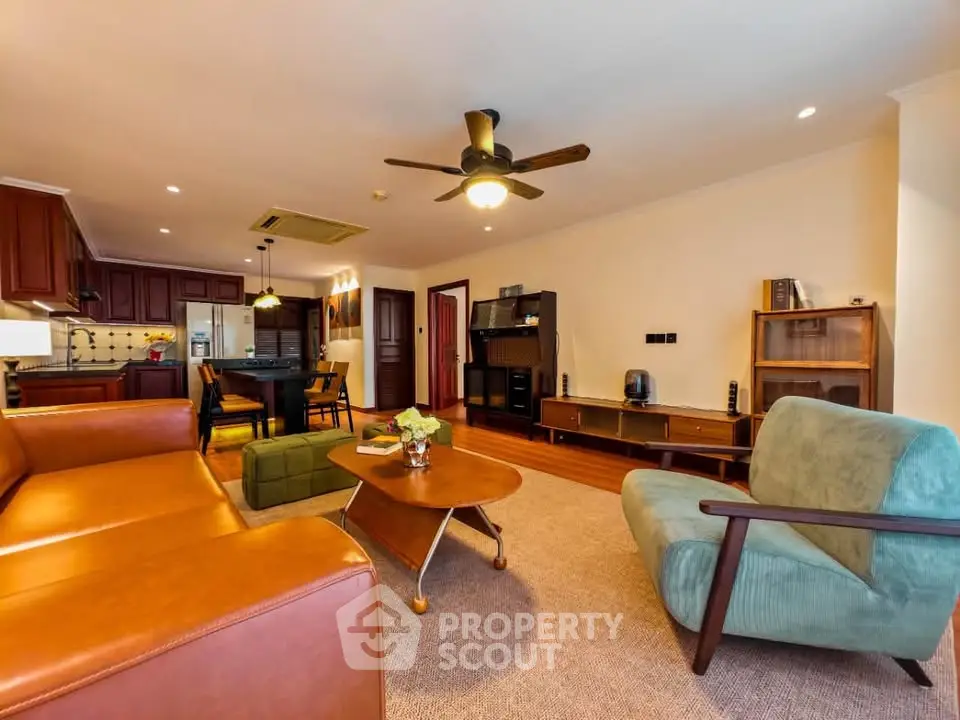 Spacious living room with modern furniture and open kitchen layout