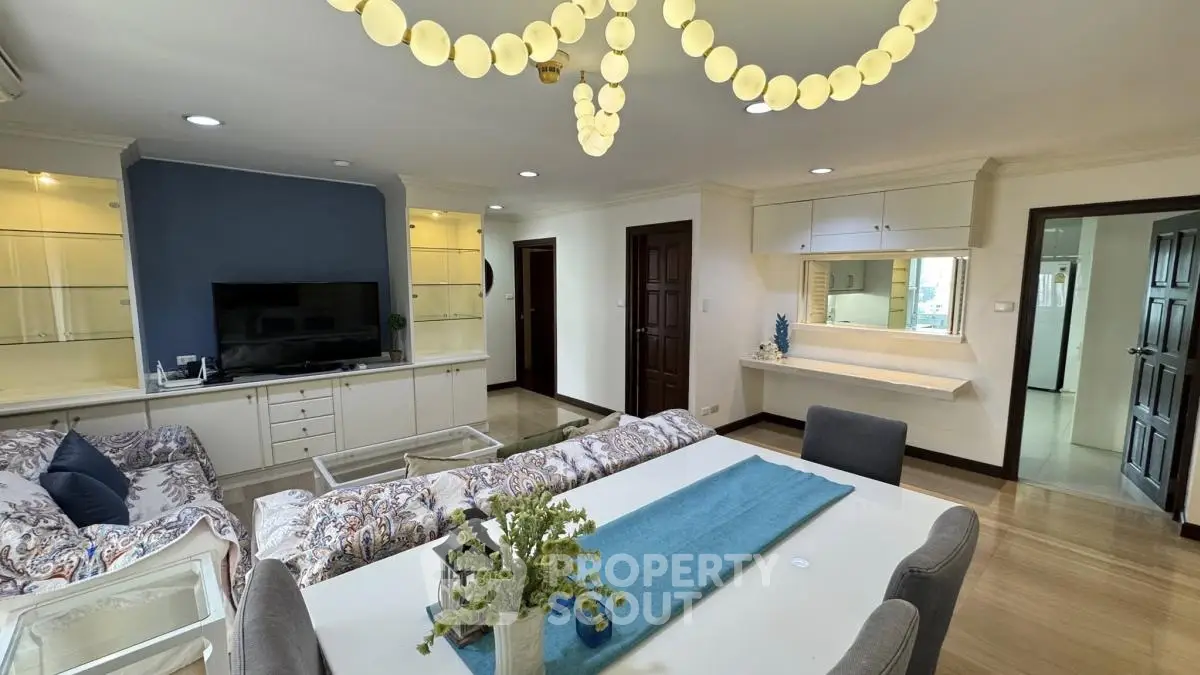 Spacious living room with elegant decor and modern furnishings in a stylish apartment.