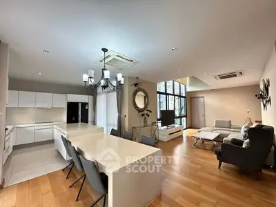 Spacious modern living room with open kitchen and elegant decor