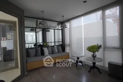 Modern living room with stylish decor and large windows for natural light