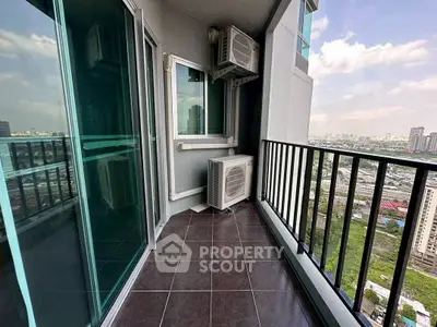 Spacious balcony with city view in modern high-rise apartment