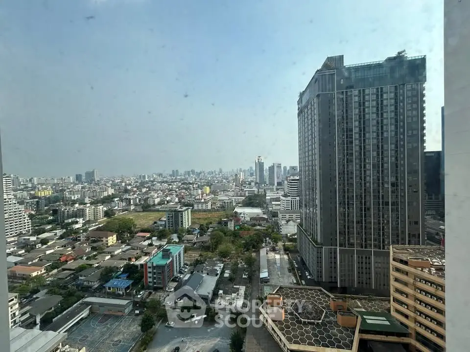Stunning cityscape view from high-rise building showcasing urban skyline and modern architecture.