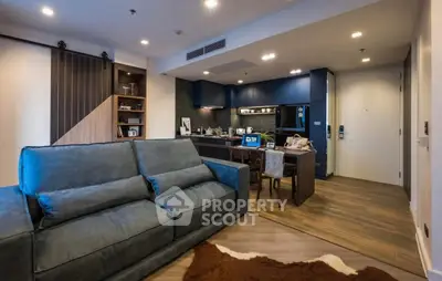 Modern living room with stylish open kitchen and cozy seating area