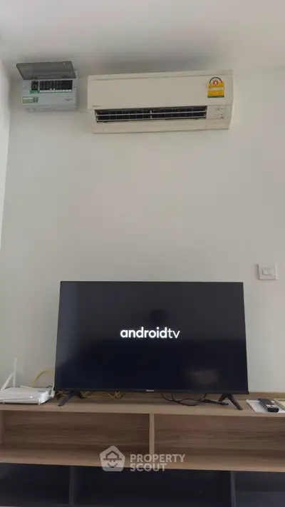Modern living room with Android TV and air conditioning unit