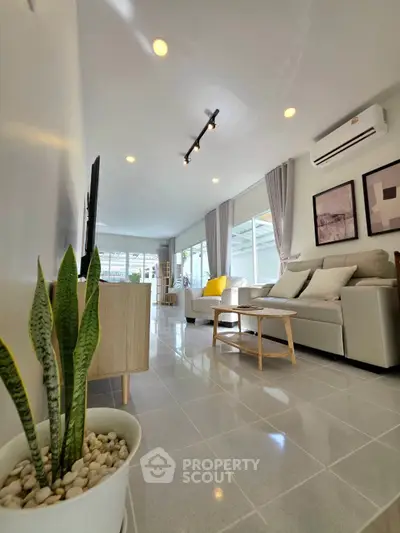 Spacious modern living room with elegant decor and natural light