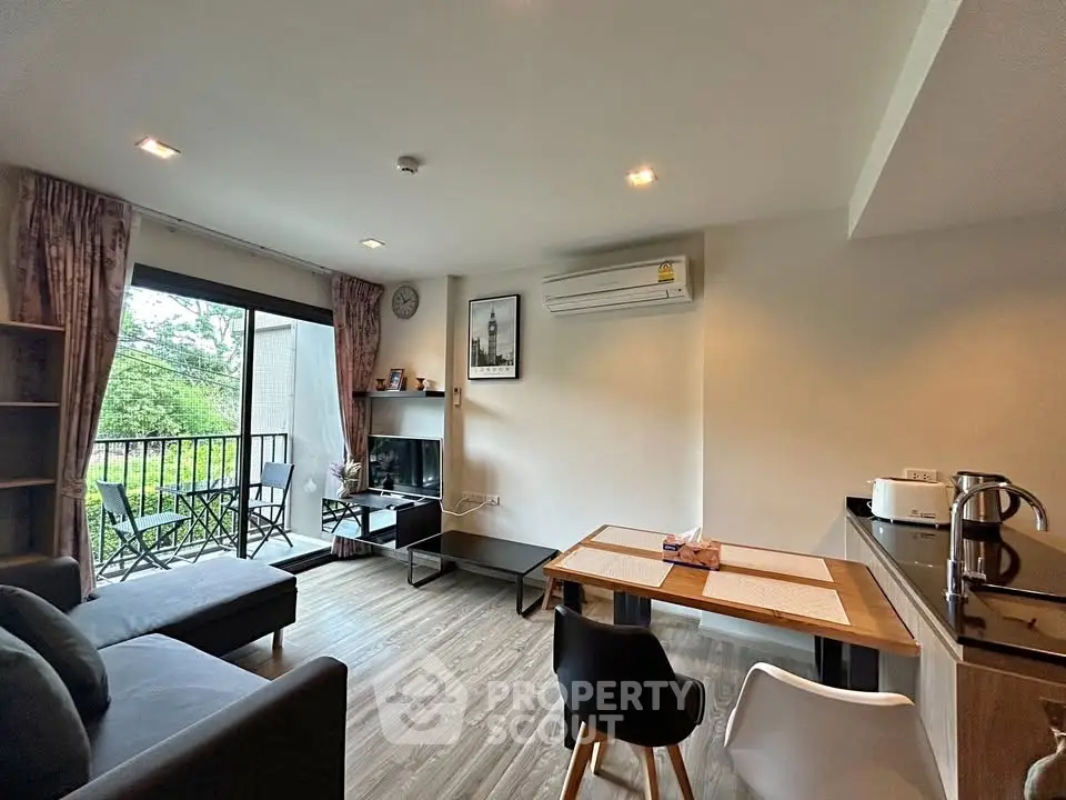 Modern living room with balcony view and stylish furniture