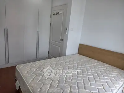 Spacious bedroom with built-in wardrobe and cozy bed, perfect for restful nights.