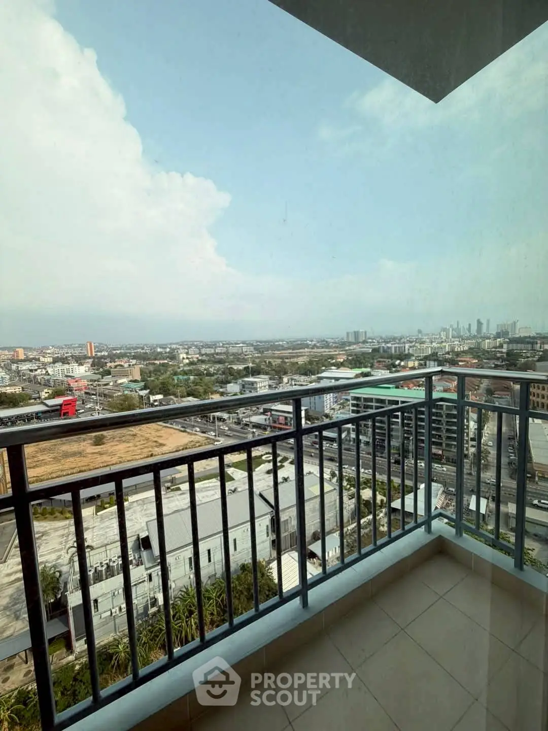 Stunning cityscape view from a high-rise balcony with expansive skyline.