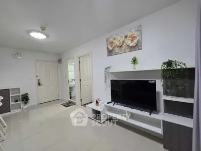Modern living room with sleek TV unit and elegant decor