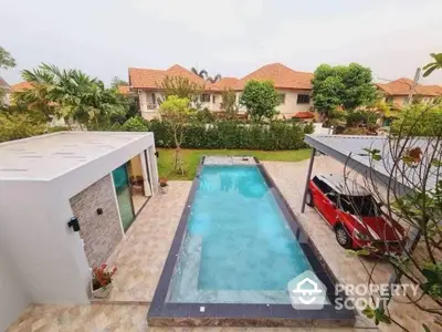 Luxurious villa with private pool and spacious driveway in serene neighborhood