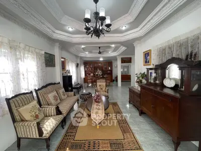 Elegant living room with classic furniture and intricate ceiling design