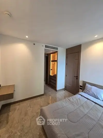 Modern bedroom with sleek design and marble flooring