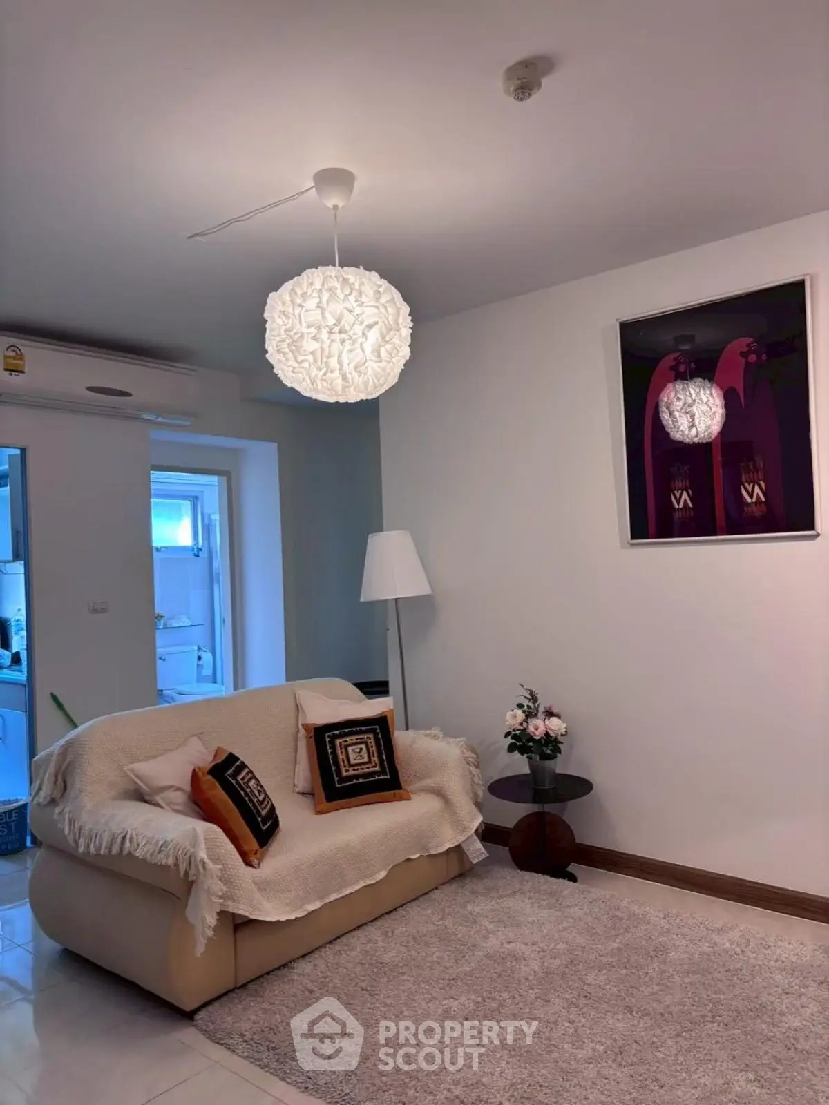 Cozy living room with modern decor and plush seating, perfect for relaxation.