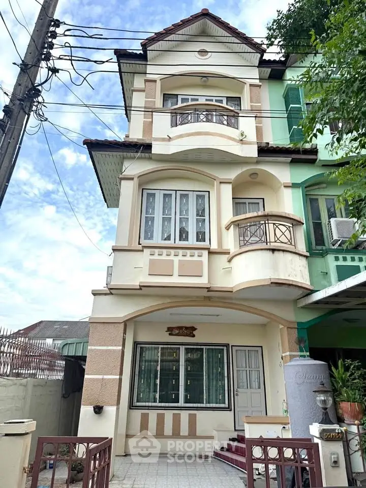 Charming three-story townhouse with unique architectural design and cozy balconies.
