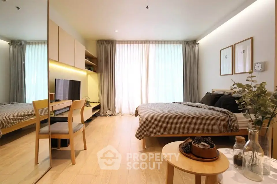 Modern bedroom with stylish decor and natural light