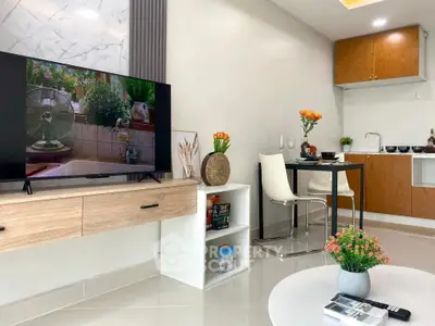 Modern living room with sleek kitchen and stylish decor