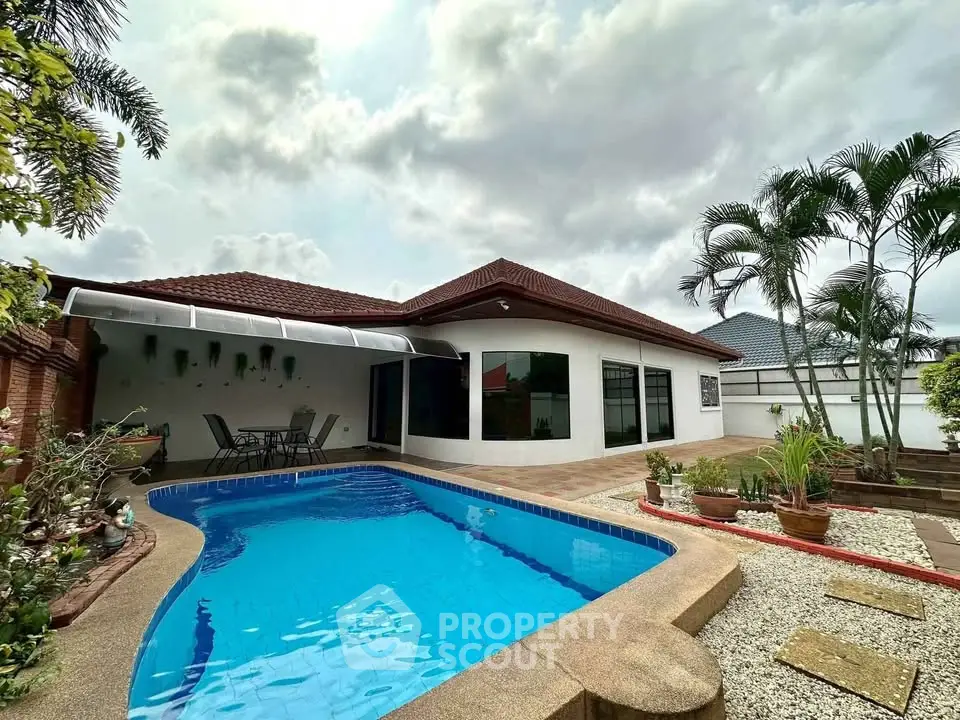 Charming single-story home with private pool and lush garden, perfect for relaxation and outdoor entertaining.
