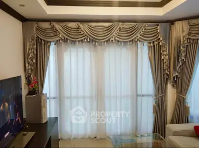 Elegant living room with luxurious drapes and modern decor