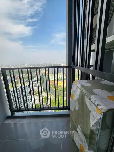 Stunning high-rise balcony with panoramic city view, perfect for relaxation and enjoying the skyline.