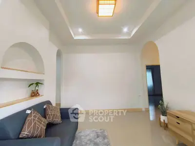 Spacious living room with modern decor and cozy seating area