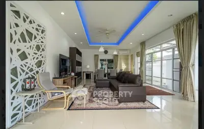 Spacious modern living room with elegant decor and ambient lighting