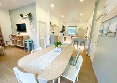 Modern open-plan living and dining area with stylish decor and natural light