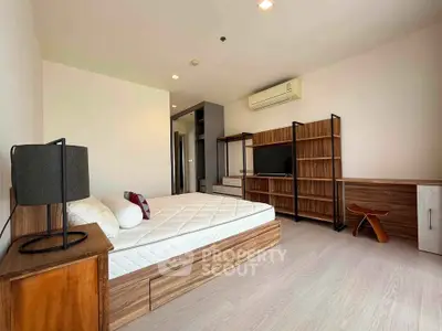 Spacious modern bedroom with wooden furniture and natural light