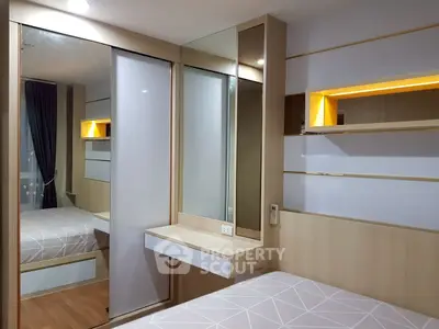 Modern bedroom with stylish built-in furniture and ambient lighting