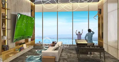 Luxurious living room with stunning ocean view and modern entertainment setup.