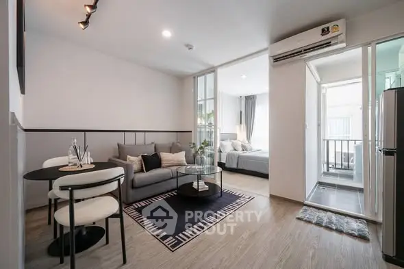 Modern open-plan living room with cozy seating and stylish decor