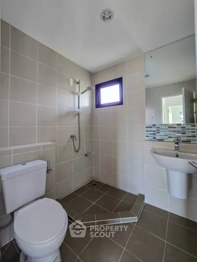 Modern bathroom with sleek fixtures and neutral tile design