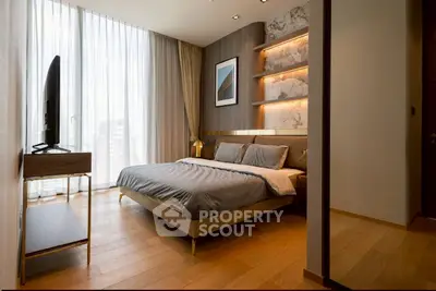 Luxurious modern bedroom with floor-to-ceiling windows and elegant decor