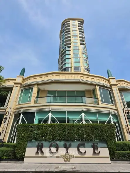 Luxurious high-rise building with modern architecture and lush greenery at Royce 39.