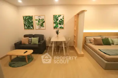 Modern studio apartment with cozy living area and stylish decor