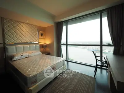 Luxurious bedroom with stunning river view and elegant decor