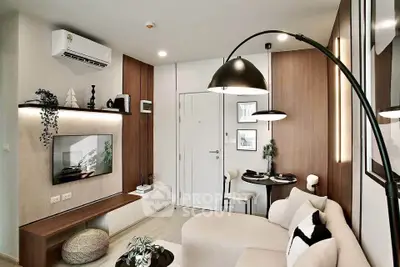 Modern living room with stylish decor and cozy seating area, perfect for relaxation and entertainment.